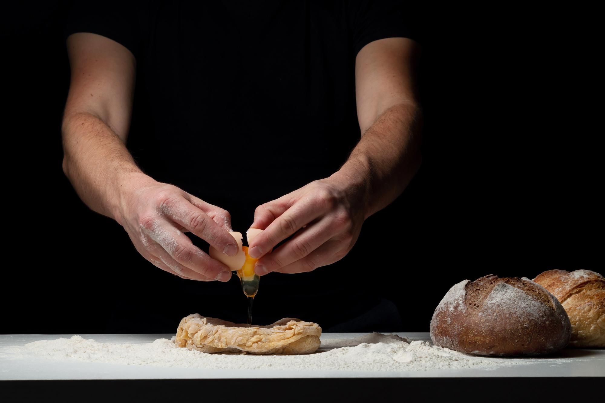 Chef slicing artisanal bread